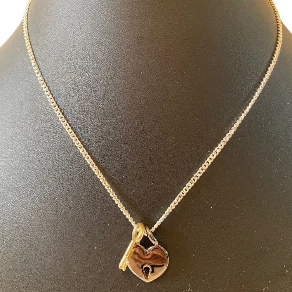 Gun Metal Heart Shaped Lock w/ Gold Tone Key on Serpentine Chain.